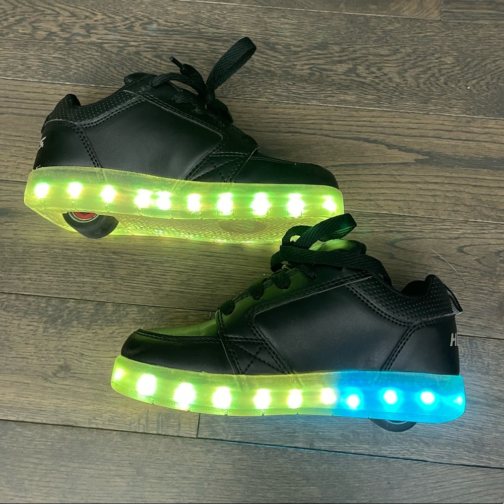 Heelys Premium Lights shoe in youth size 2. Color black.